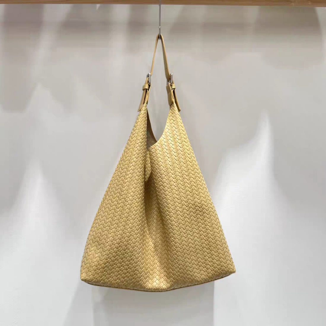 Cosbai woven slouchy hobo bag with soft slouchy silhouette displayed upright