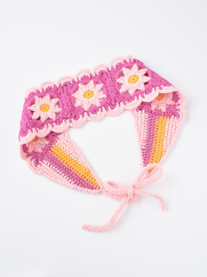 Top view of crochet flower hairband displaying colorful flower patterns