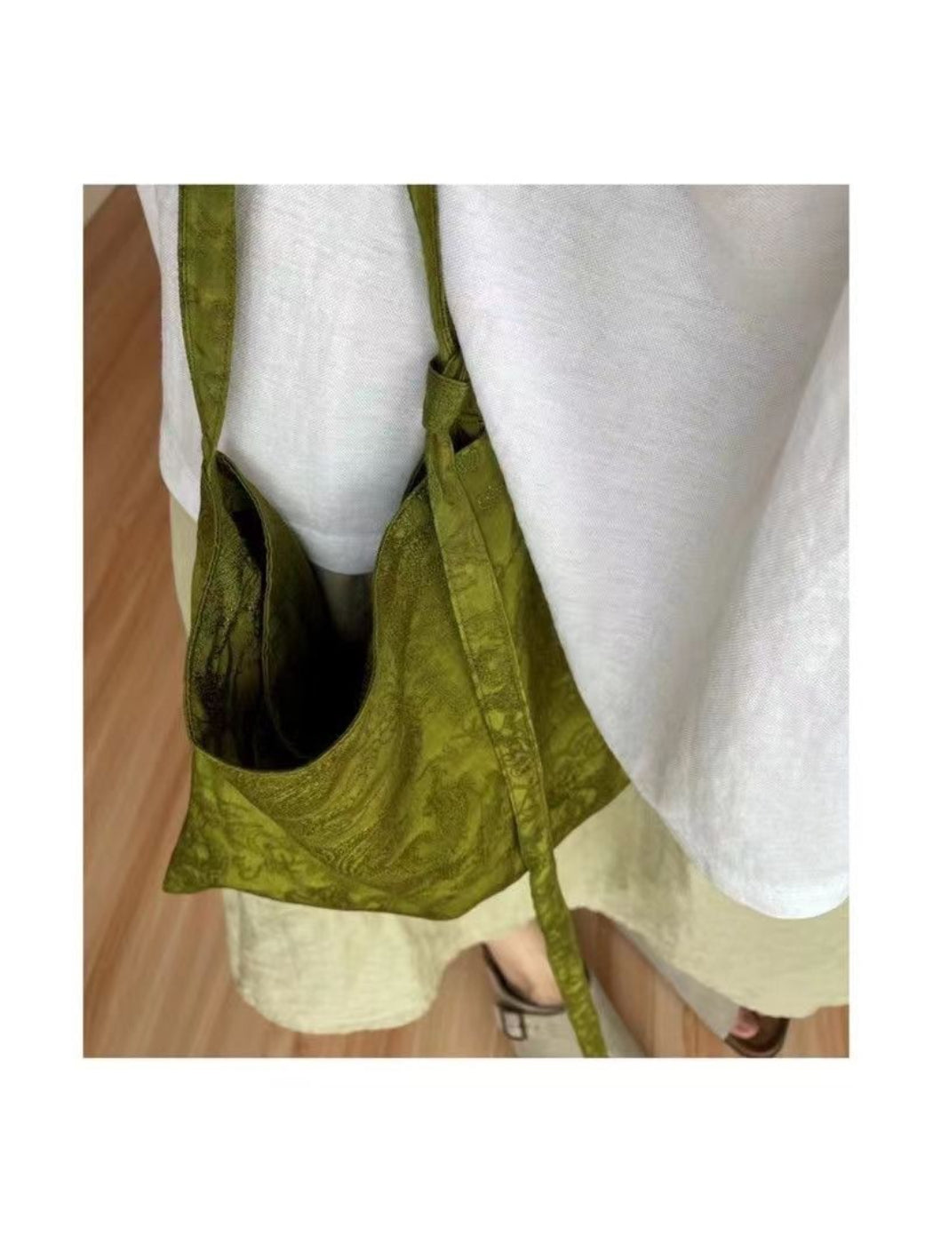 Cosbai foldable shopper bag with olive design shown being carried by hand