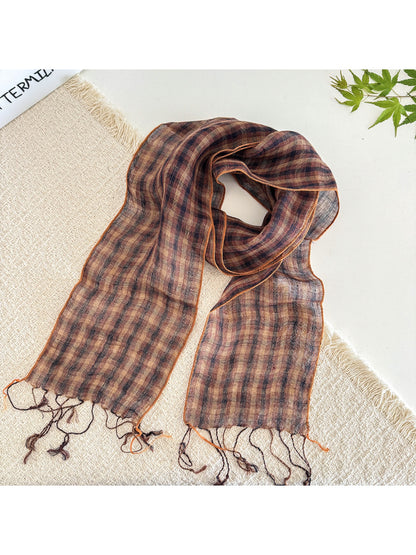 Soft check pattern long skinny scarf wrapped loosely around a mannequin neck