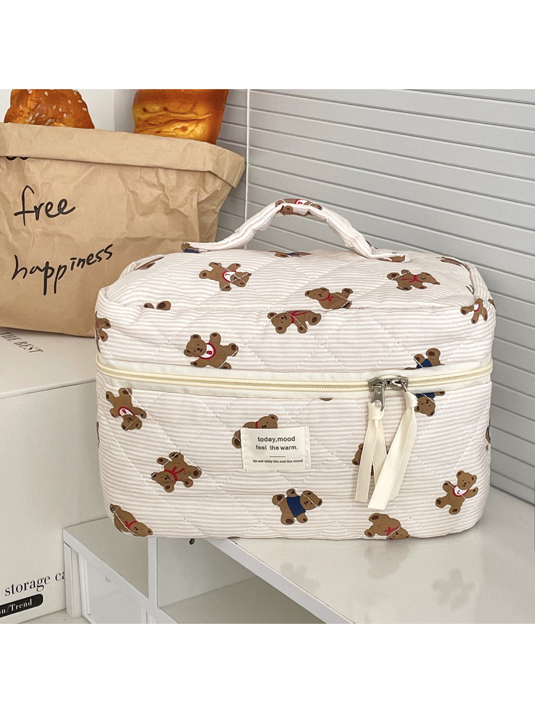 Cosbai beauty storage bag open with makeup brushes and cosmetics inside