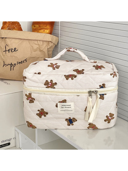 Cosbai beauty storage bag open with makeup brushes and cosmetics inside