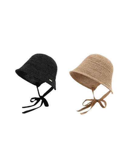 Haila woven straw bucket hat with ribbon tie displayed on a white background