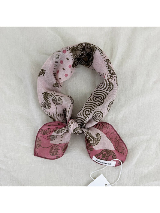 Close-up of Scarvii Patchwork Paisley Square Scarf fabric highlighting detailed paisley and floral print
