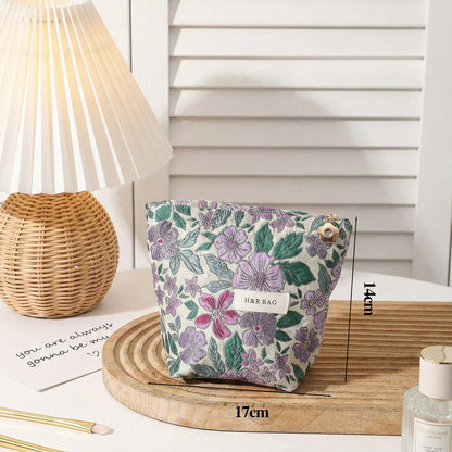 Cosbai textured flower cosmetic bag with chain strap hanging against plain background