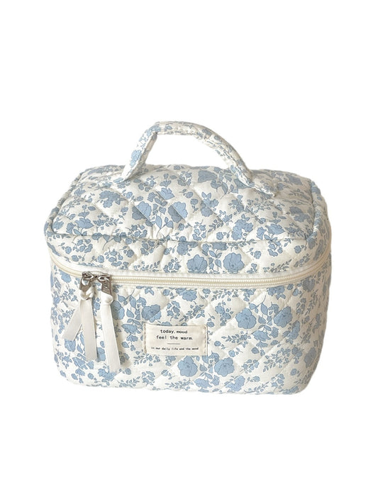 Cosbai blue floral quilted vanity bag with a rectangular shape and floral pattern