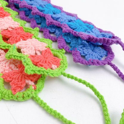 Top view of crochet flower hairband highlighting arrangement of flowers