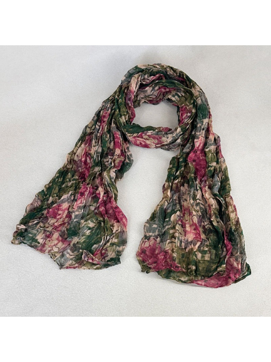 Scarvii scarf styled around a model's neck highlighting the soft fabric and artistic print