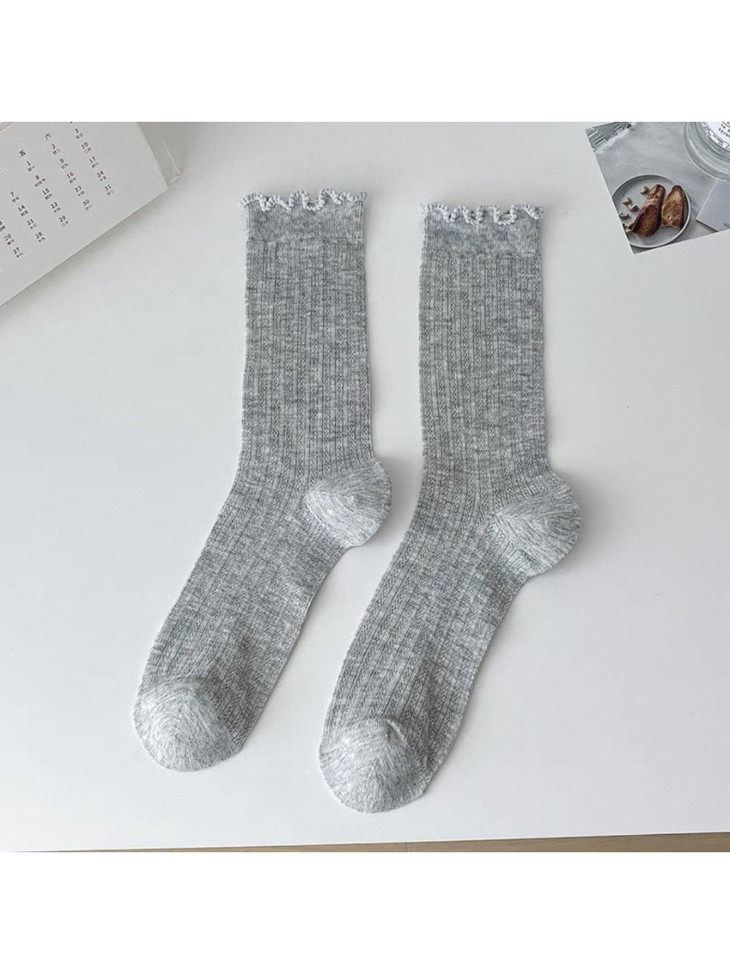 Model wearing Rufia soft ribbed ruffle crew socks with casual shoes