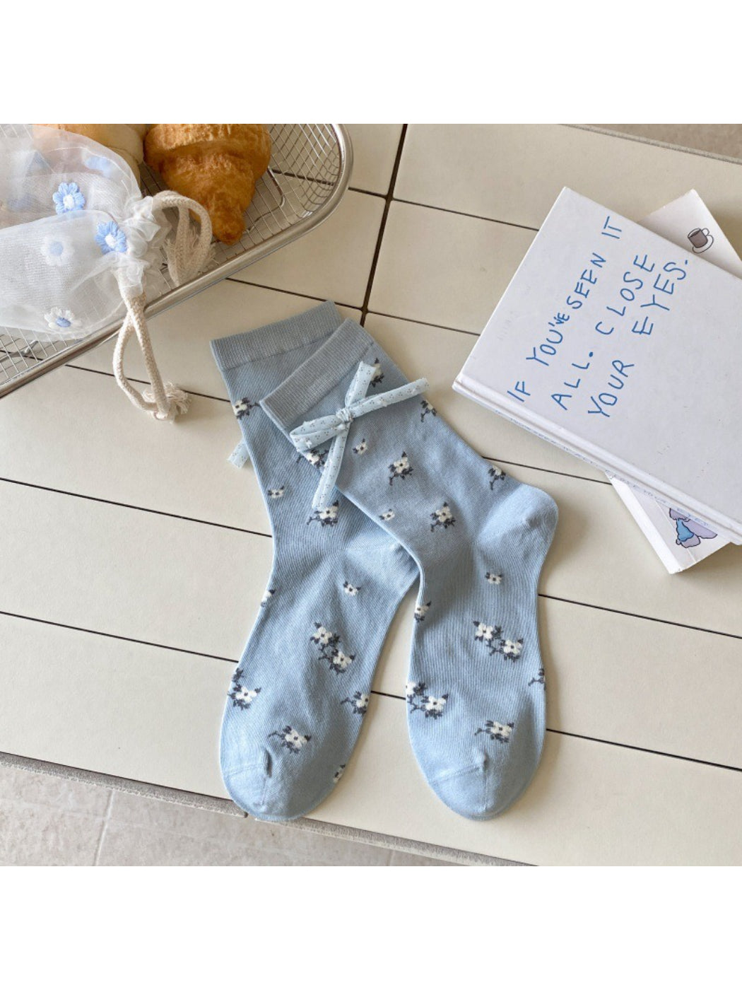 Rufia Sweet Blue Grey crew socks displayed with packaging and branding