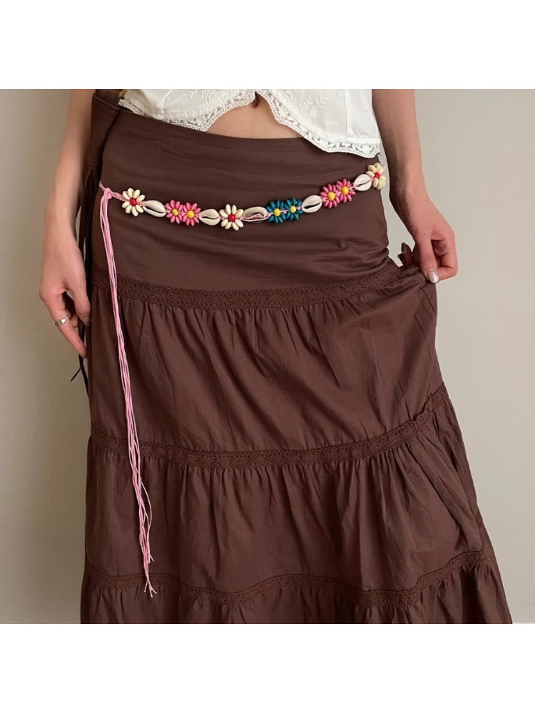 Close-up of Beco floral shell shaped rope waist belt with detailed shell design