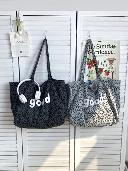 Side view of Cosbai leopard graphic tote bag showing depth and handle