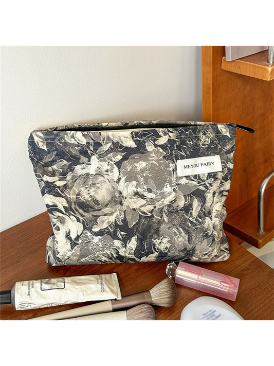 Cosbai floral makeup bag with pink and white flower pattern on a beige background