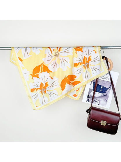 Scarvii Lily Print Square Scarf draped over shoulder showcasing soft fabric and colorful lily design
