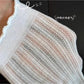 Close-up of ribbed texture and ruffle detail on Rufia beige crew socks
