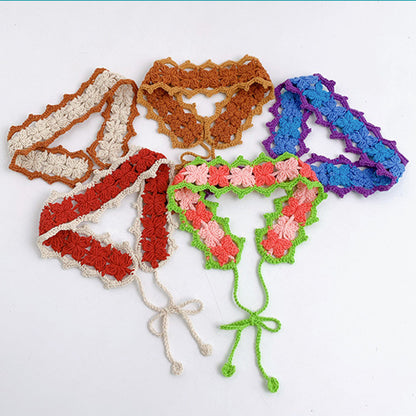 Close-up of crochet flower hairband with pink and white flowers on beige band
