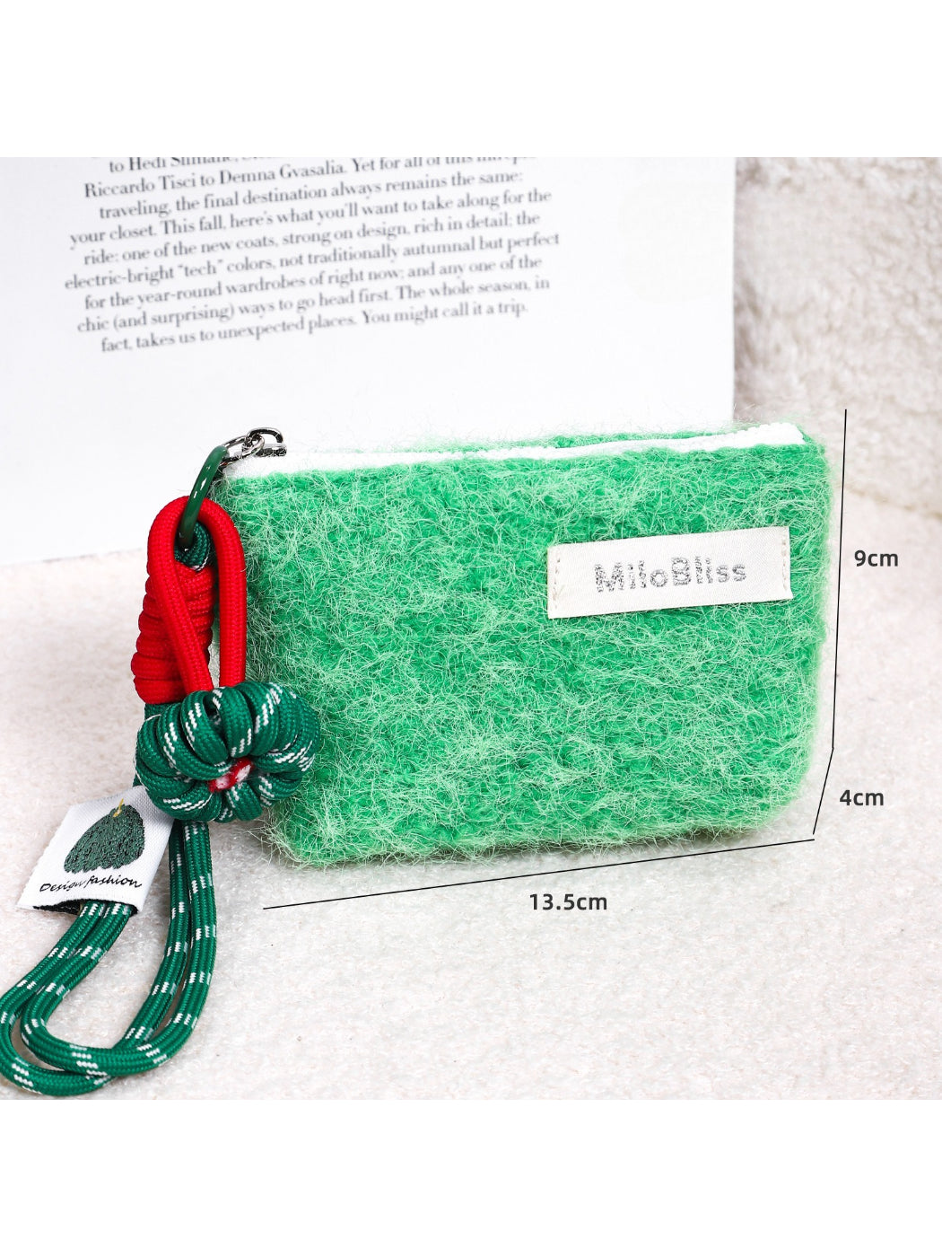 Cosbai fluffy mini pouch with wrist cord photographed from side angle
