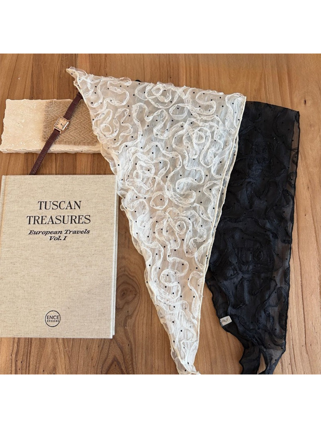 Close-up of sheer rosette triangle scarf fabric highlighting delicate floral rosette design