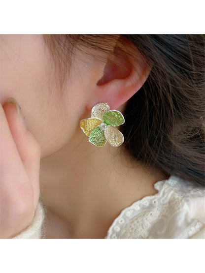 Close-up of Earwish floral cluster earrings showing detailed multicolor petals