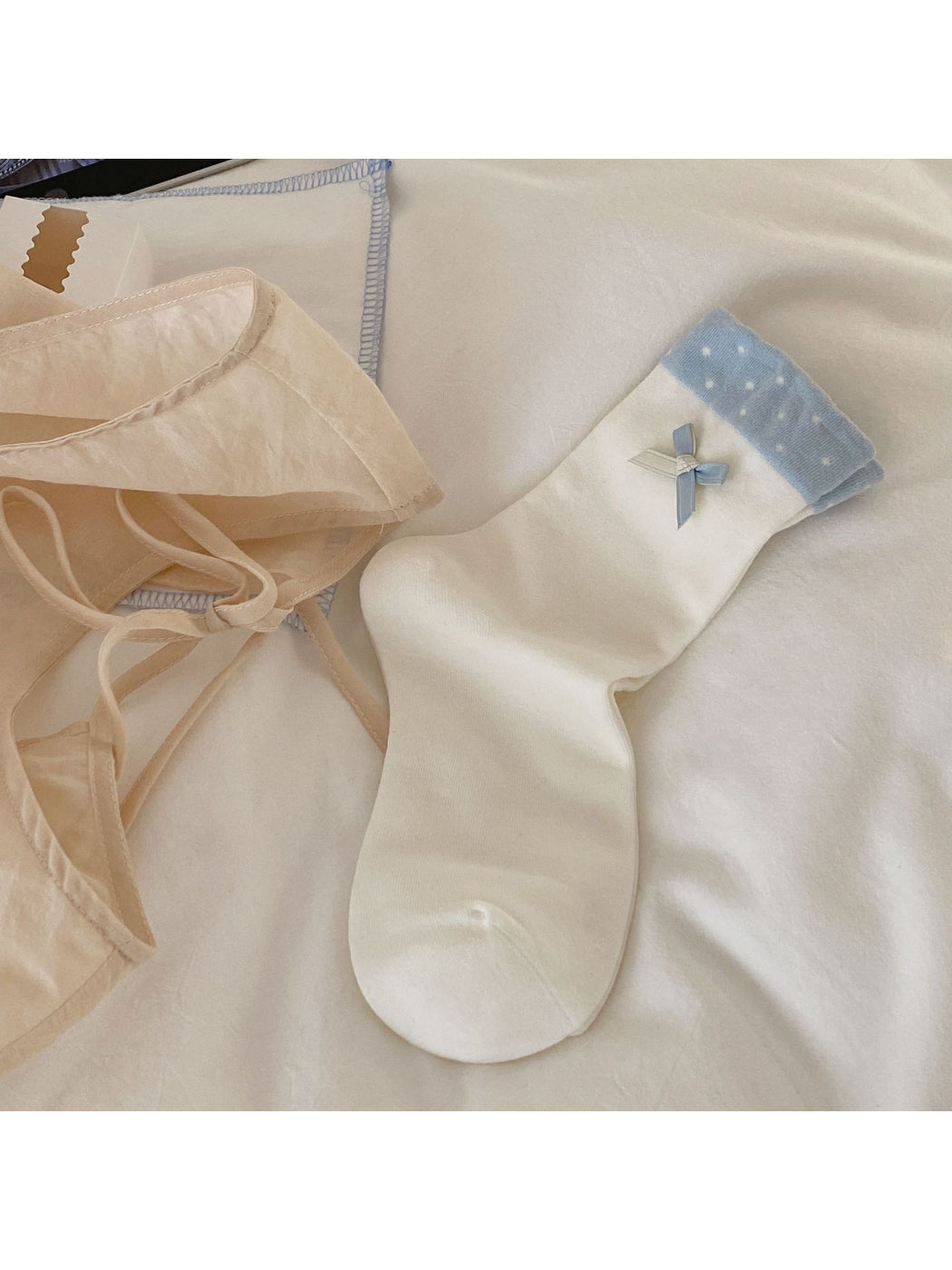 Rufia ruffle detail crew socks paired with denim outfit on model