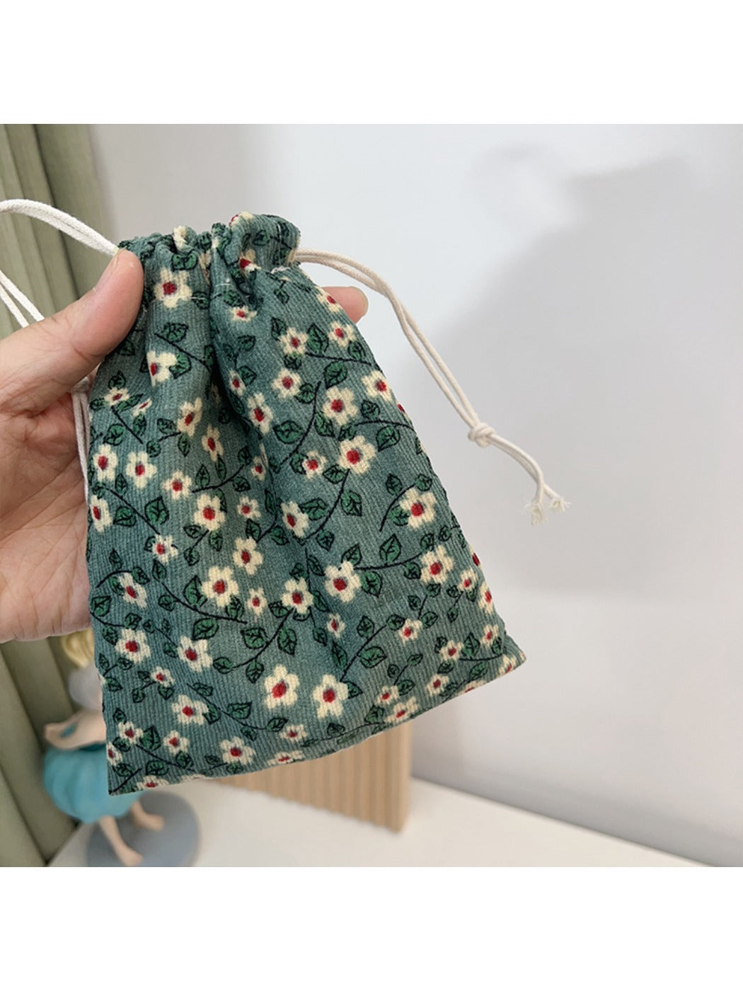 Close-up of Cosbai mini floral drawstring pouch showing vibrant flower design