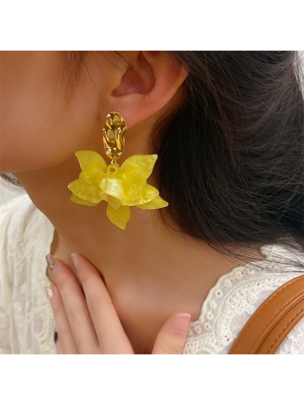 Earwish floral drop earrings displayed with natural light highlighting their shine