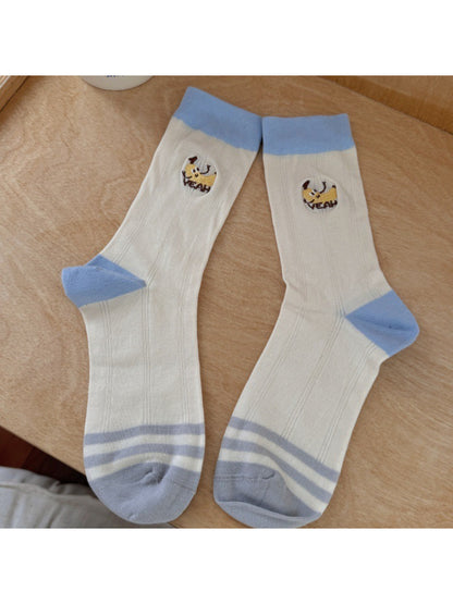Rufia socks worn on feet, highlighting fruit designs and ankle length