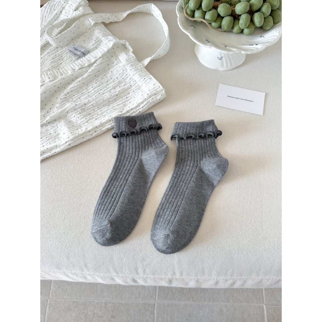 Side view of Rufia socks showing stretch and lettuce cuff texture