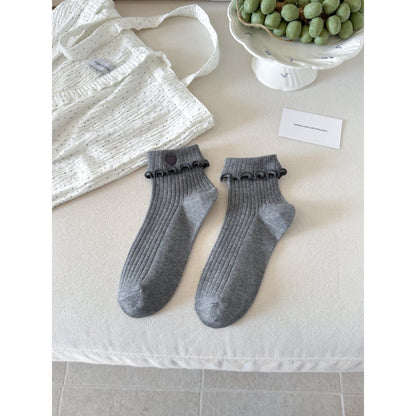 Side view of Rufia socks showing stretch and lettuce cuff texture