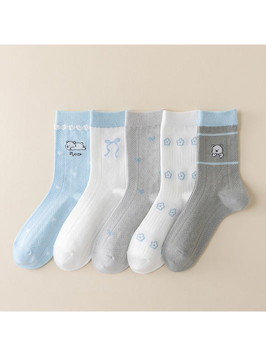Close-up of blue accent detail on Rufia crew socks showing fabric texture