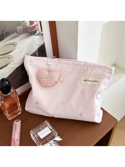Close-up of Cosbai cosmetic bag and heart pattern details