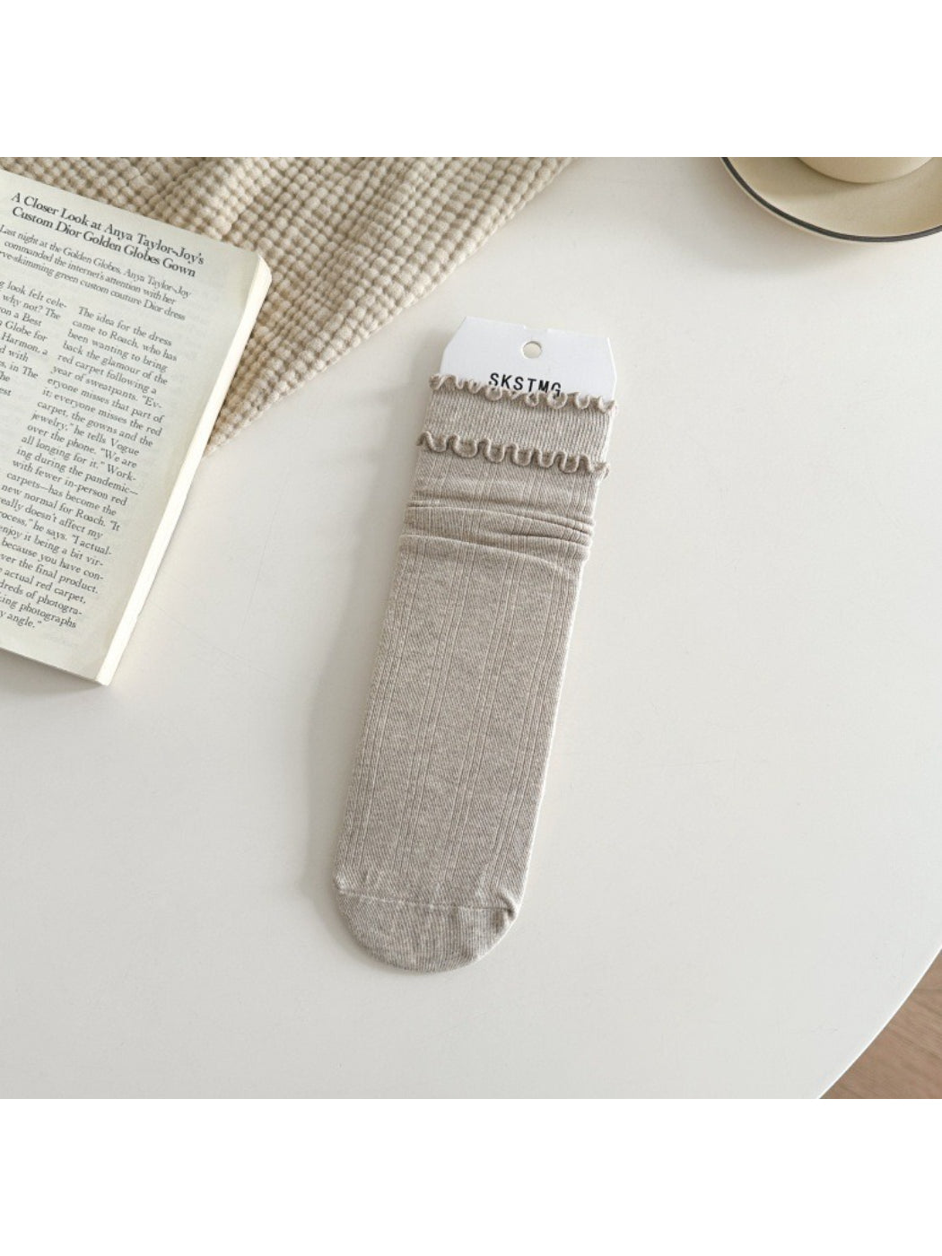 Rufia ruffle mid-calf socks in light brown color paired together