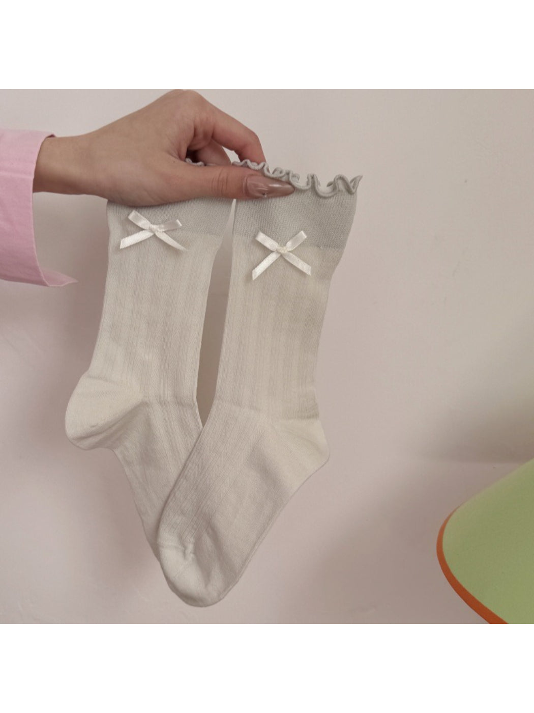 Side view of Rufia socks showing the bow and frill detail on the ankle