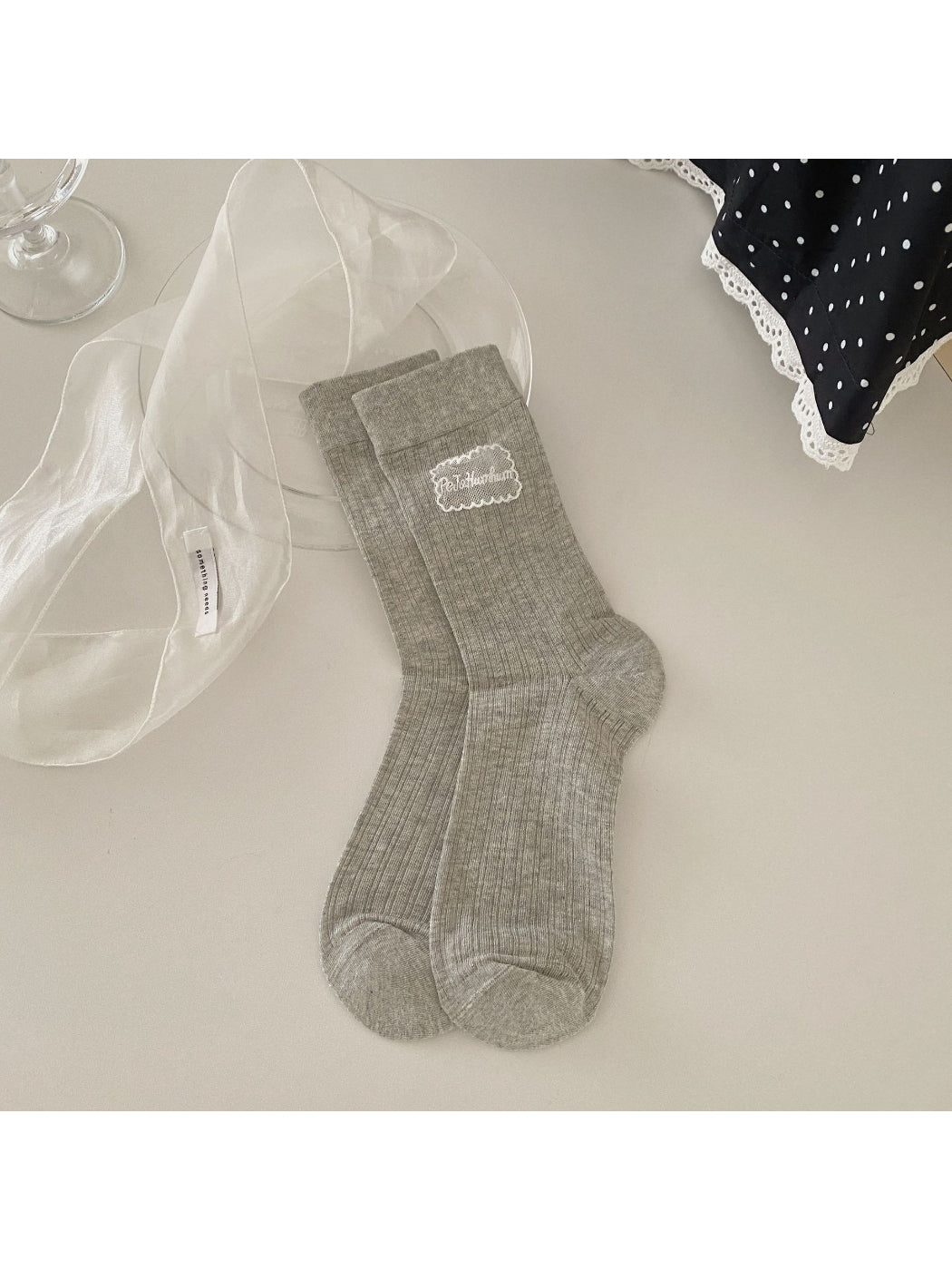 Rufia Sweet Label crew socks packaged in branded box with logo visible