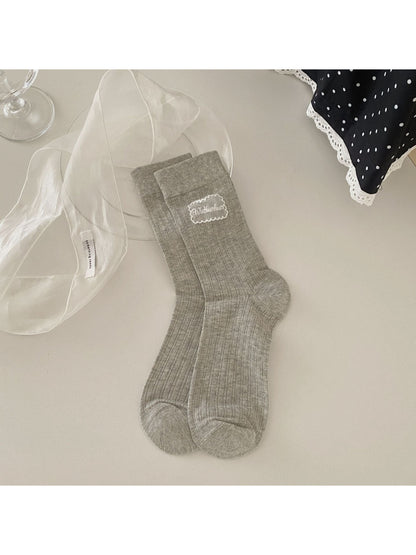Rufia Sweet Label crew socks packaged in branded box with logo visible