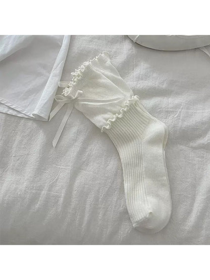 Rufia Ribbon Ruffle Crew Socks worn on feet showing mid-calf length and ruffle
