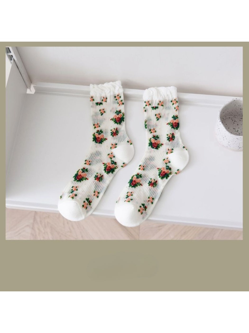 Side view of Rufia floral crew socks highlighting rose design and texture