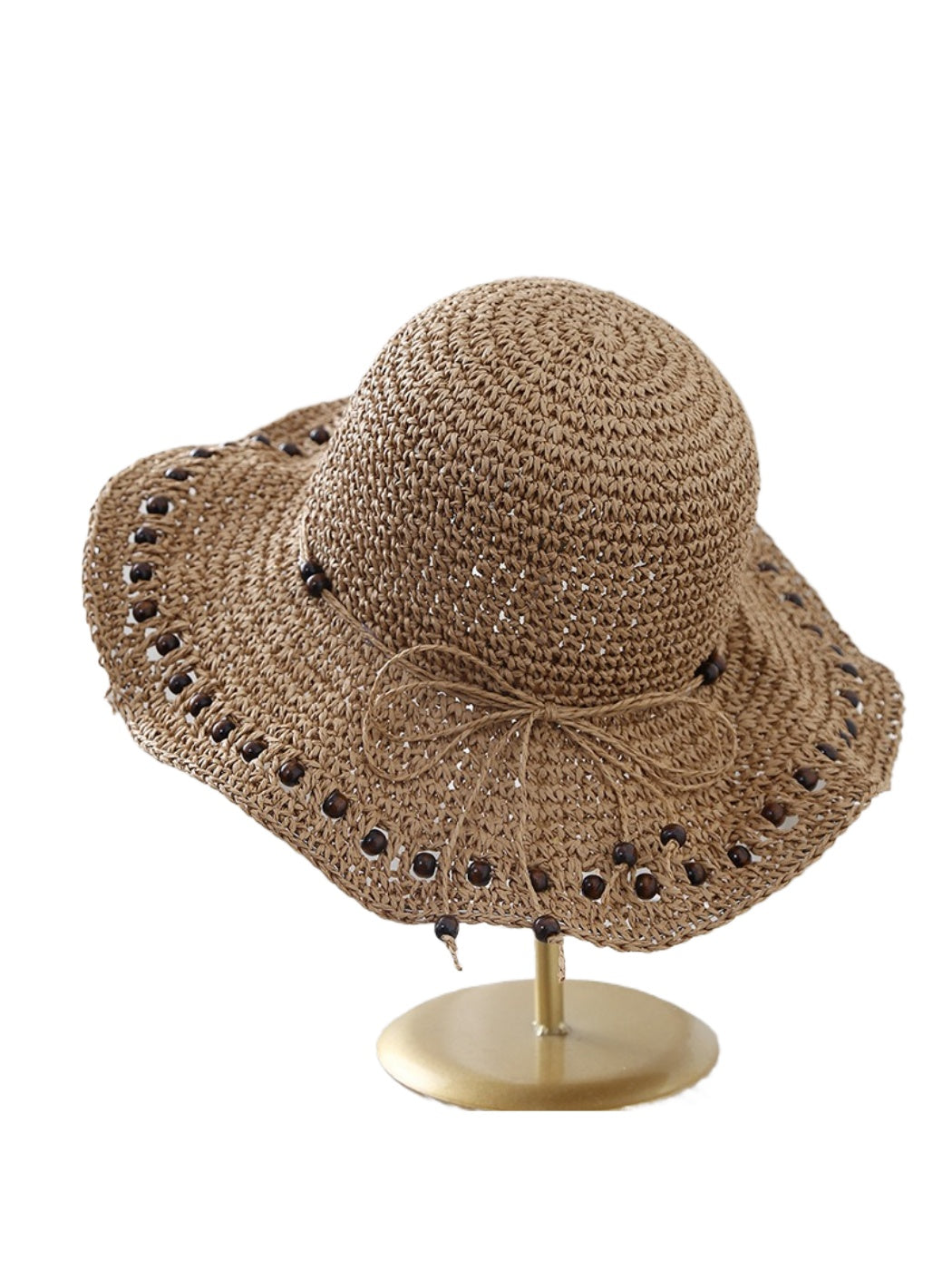 Model wearing Haila beaded edge crochet bucket hat outdoors