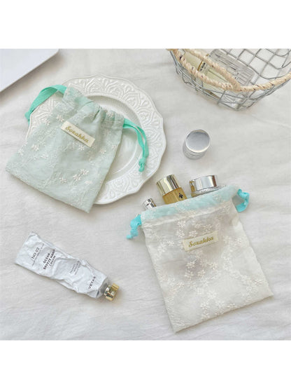 Close-up of Cosbai floral lace drawstring pouch showing detailed lace texture