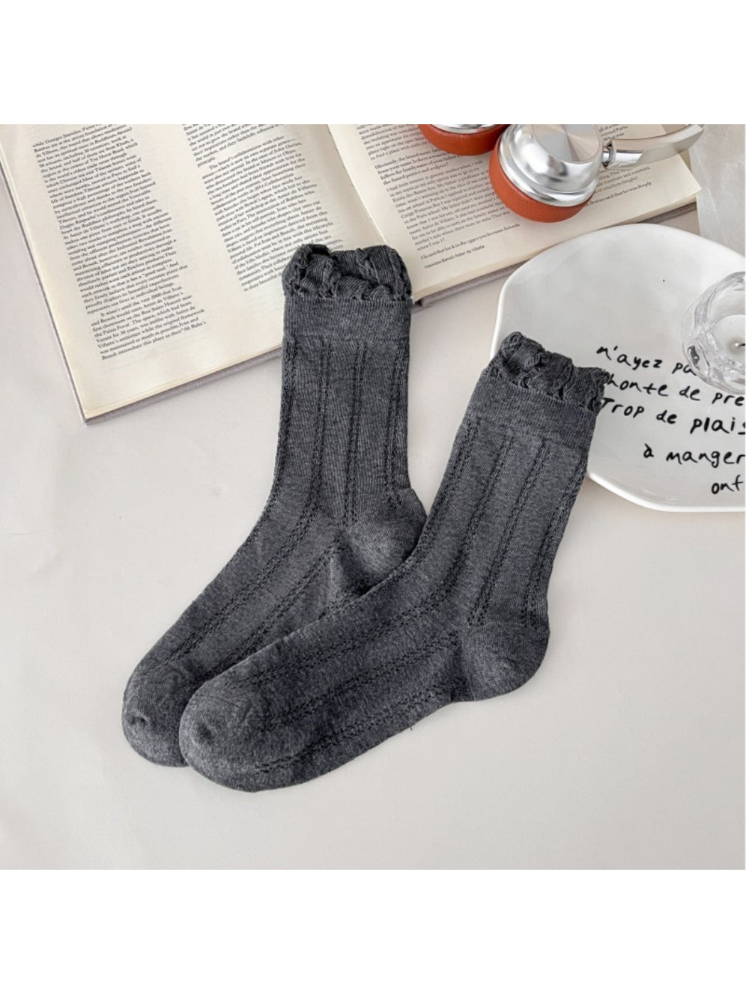 Model wearing Rufia vintage pointelle crew socks with rolled-up jeans
