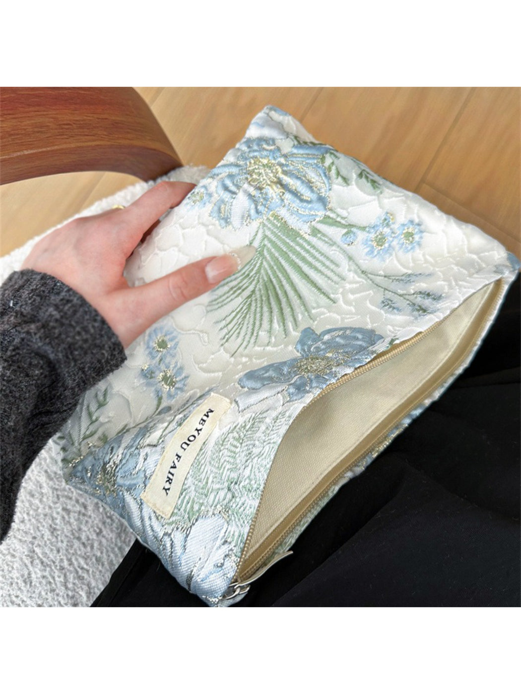 Cosbai blue floral cosmetic bag displayed on a flat surface with floral print