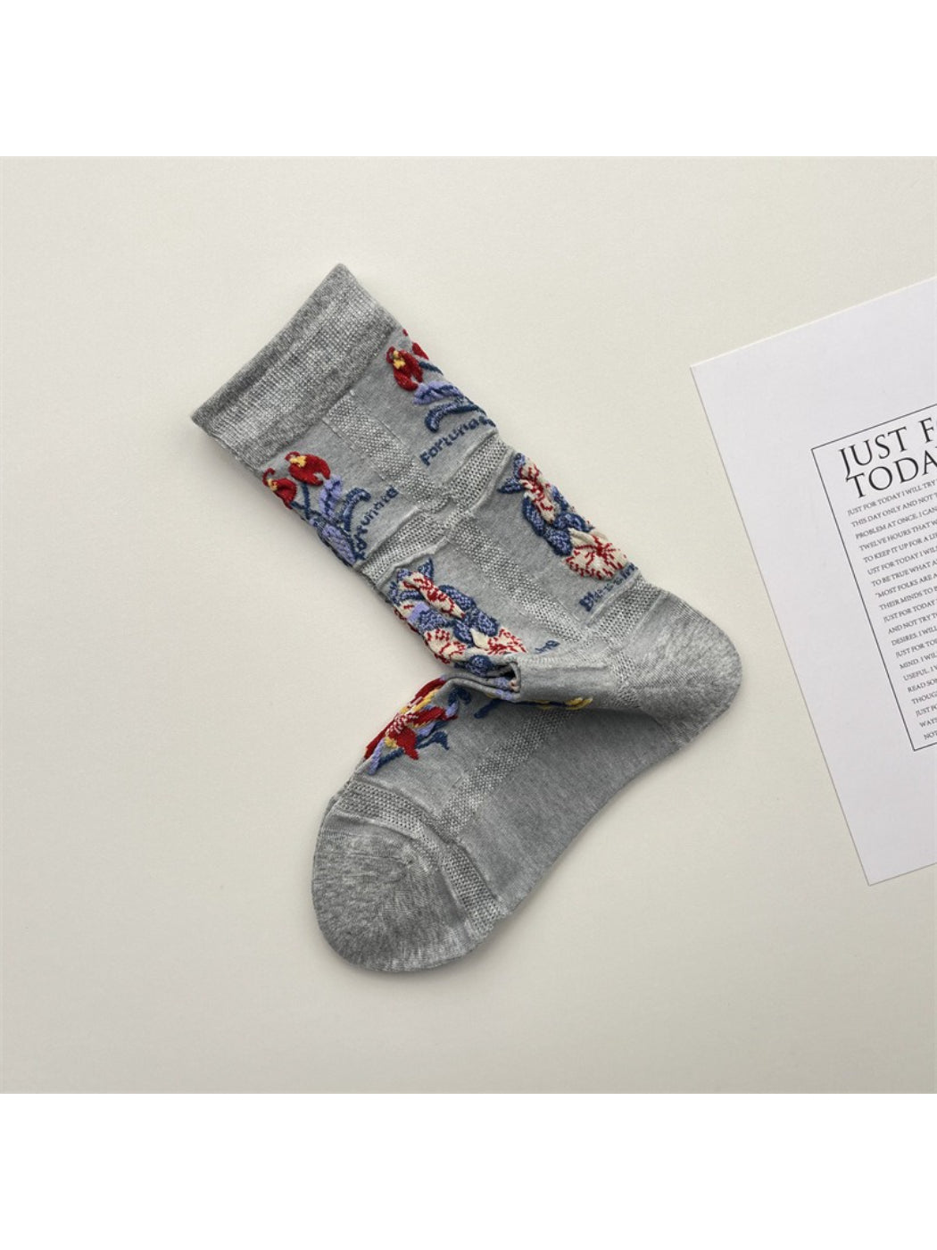 Rufia mesh floral mid-calf socks worn on feet showing mid-calf length and floral pattern