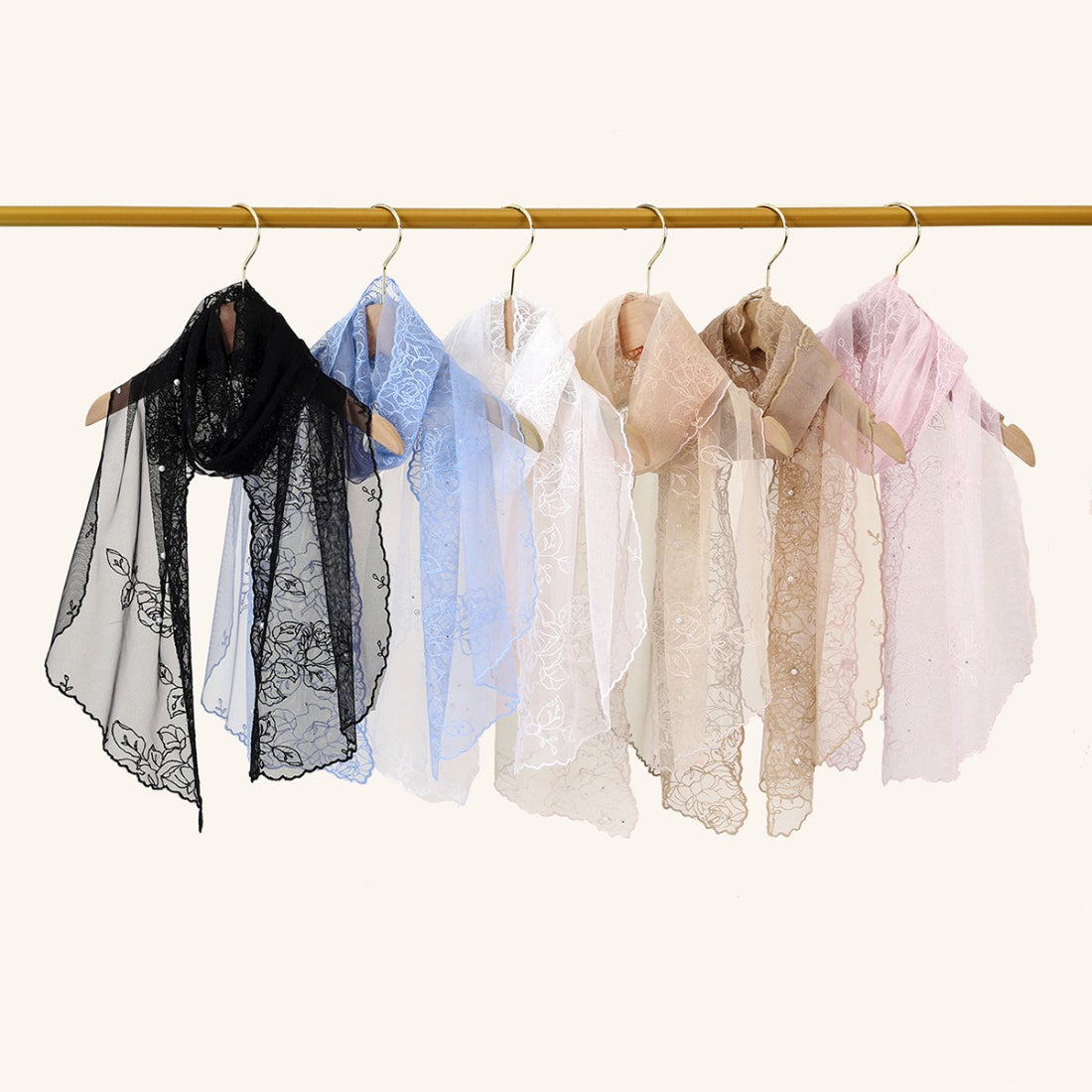 Scarvii delicate sheer floral wrap laid out with edges and floral details visible