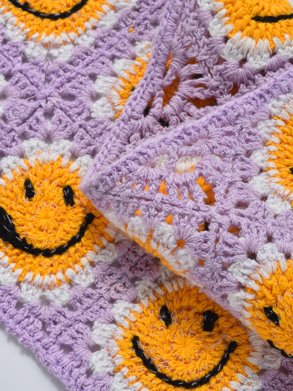Close-up of Scarvii crochet daisy smile hairband showing detailed stitching