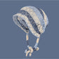 Haila hollow out lace up knit slouchy beanie in light beige displayed on white background