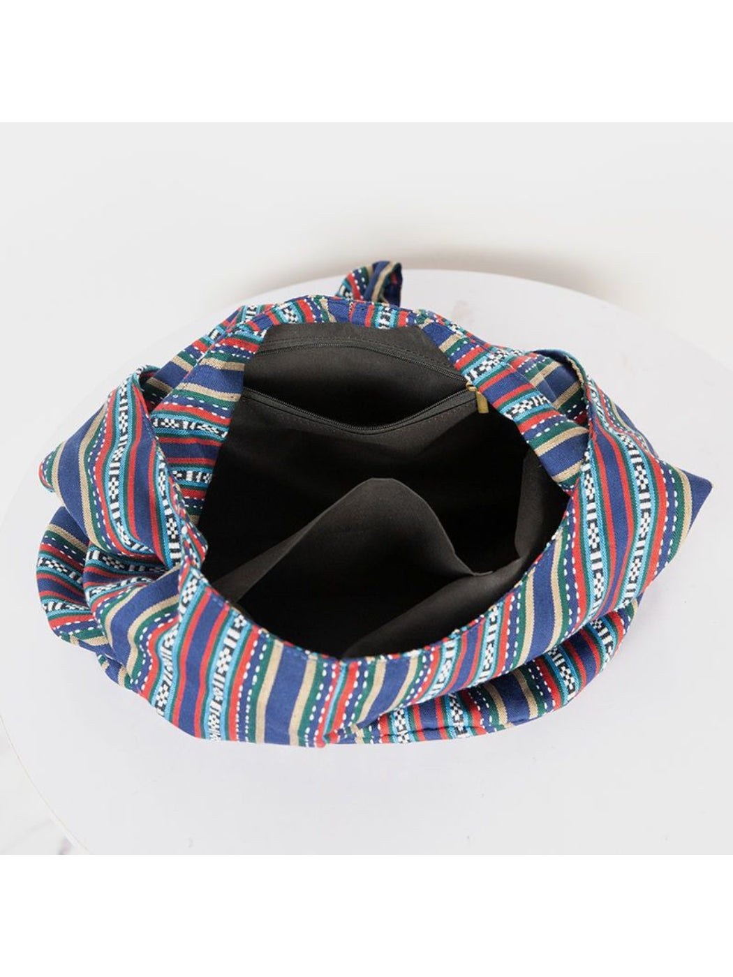 Cosbai striped slouchy crossbody bag angled to show depth and shape