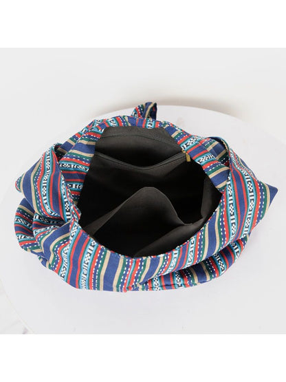 Cosbai striped slouchy crossbody bag angled to show depth and shape