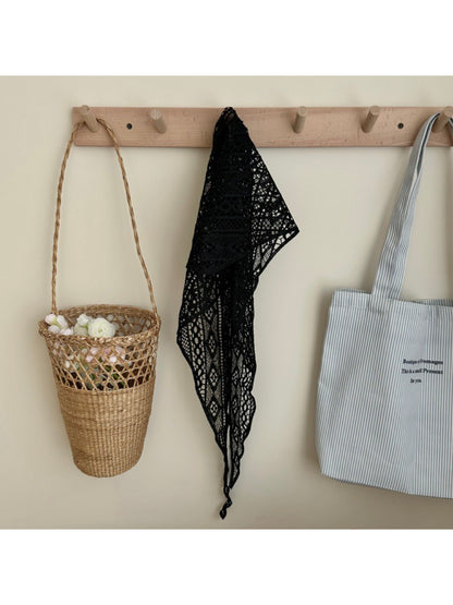 Boho crochet triangle headscarf folded to show texture and pattern details