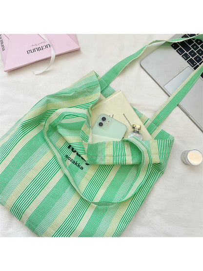 Cosbai casual stripe shopper tote bag styled with casual outfit on a white background