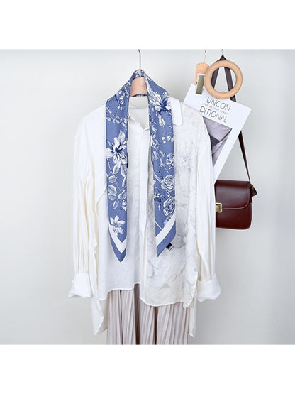 Scarvii square scarf with colorful floral print laid flat